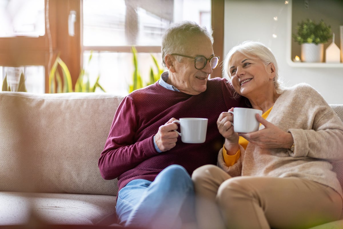 An elderly couple having coffee