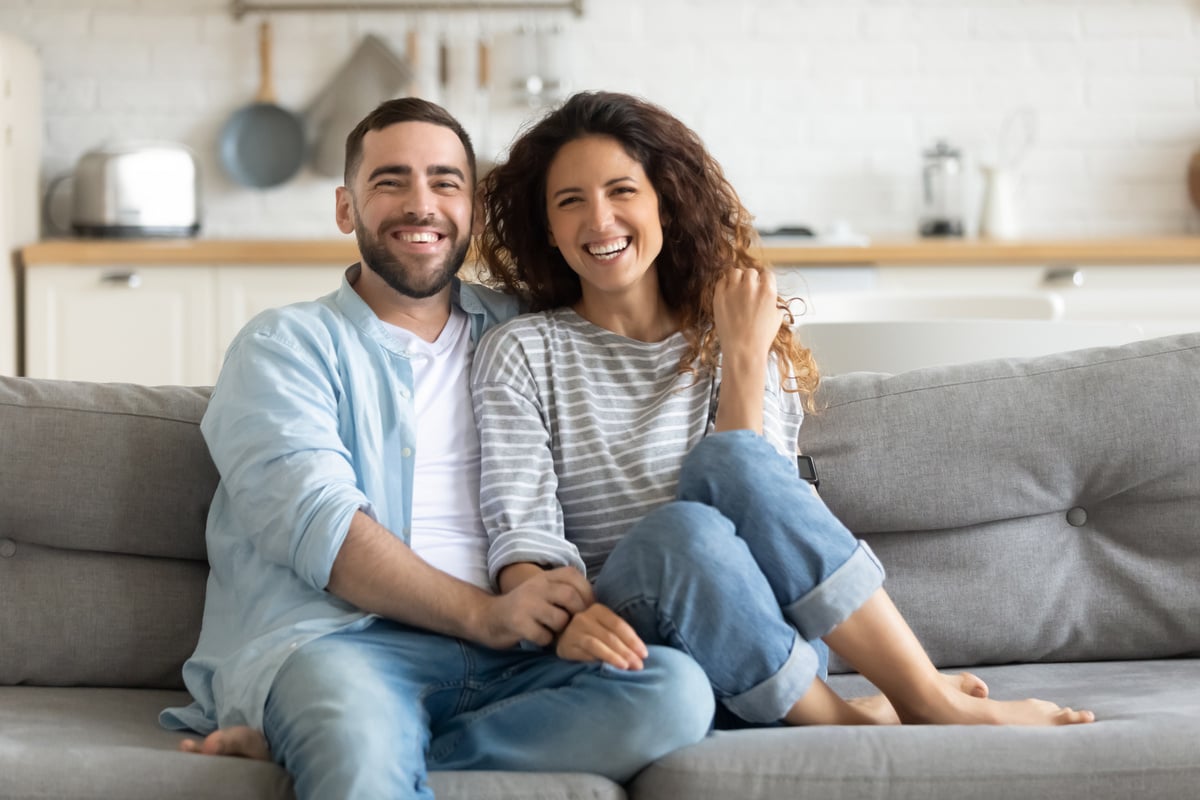 Happy tenants sitting on a couch