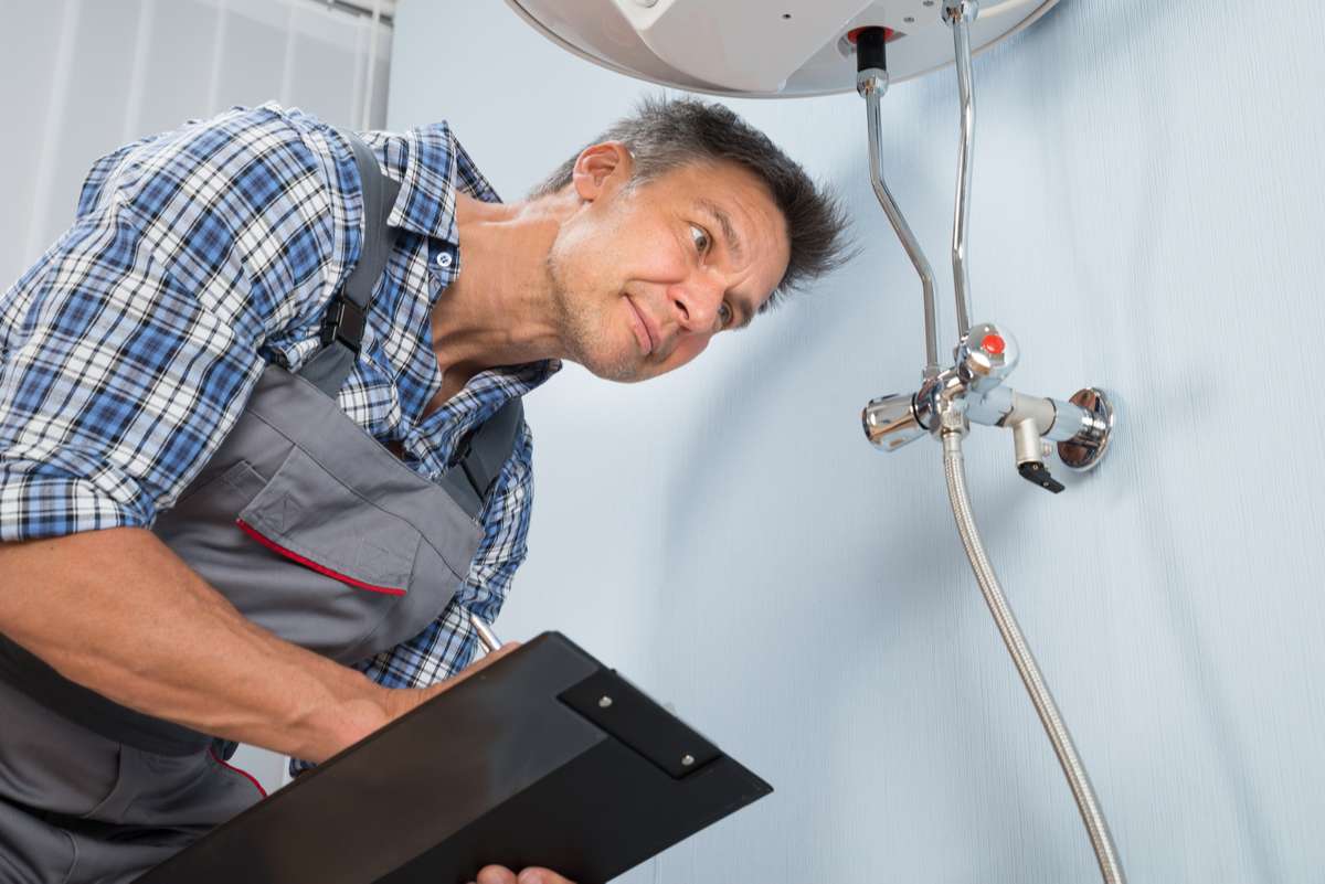 Male Plumber With Clipboard