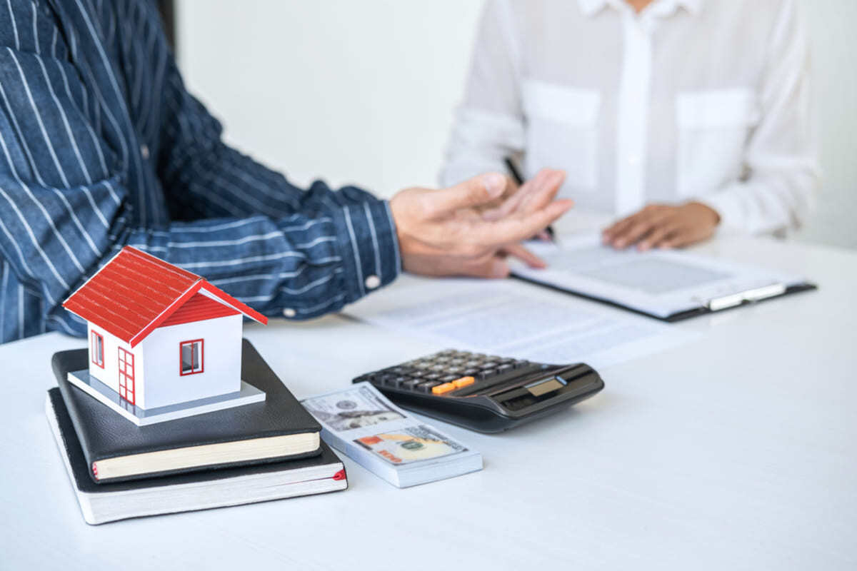 Two people conducting a rental analysis of an investment property, property management concept