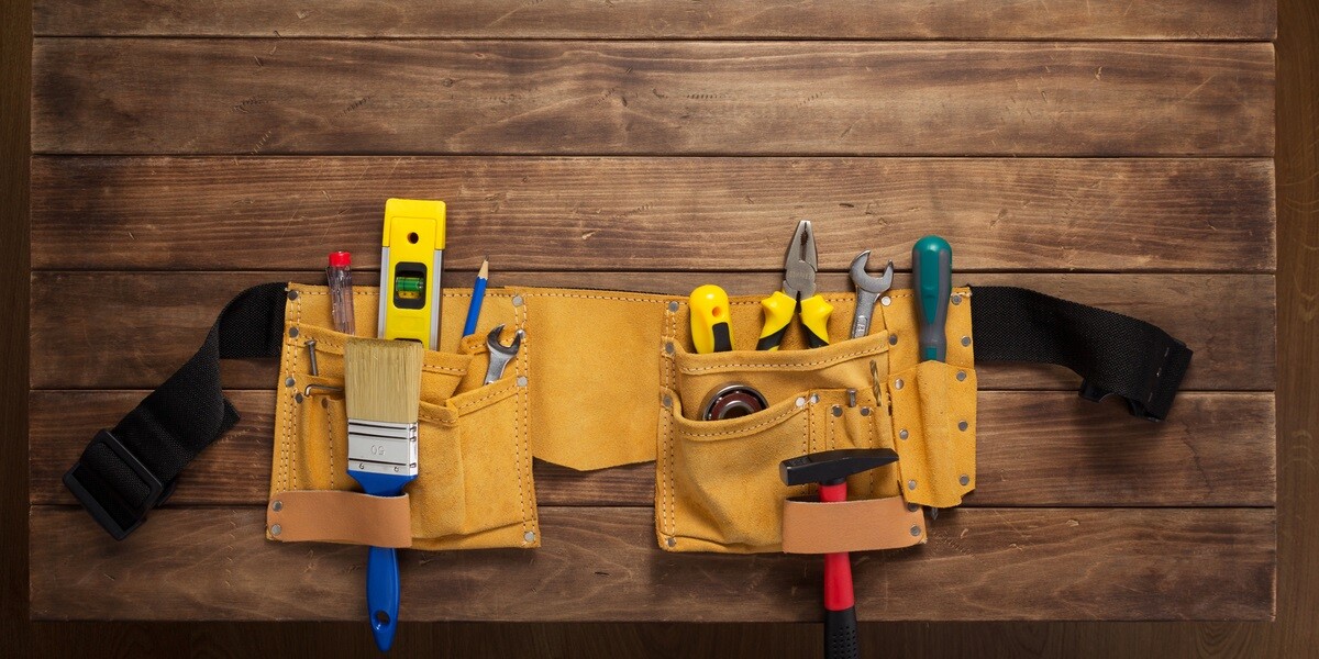 A tool belt on a wooden background