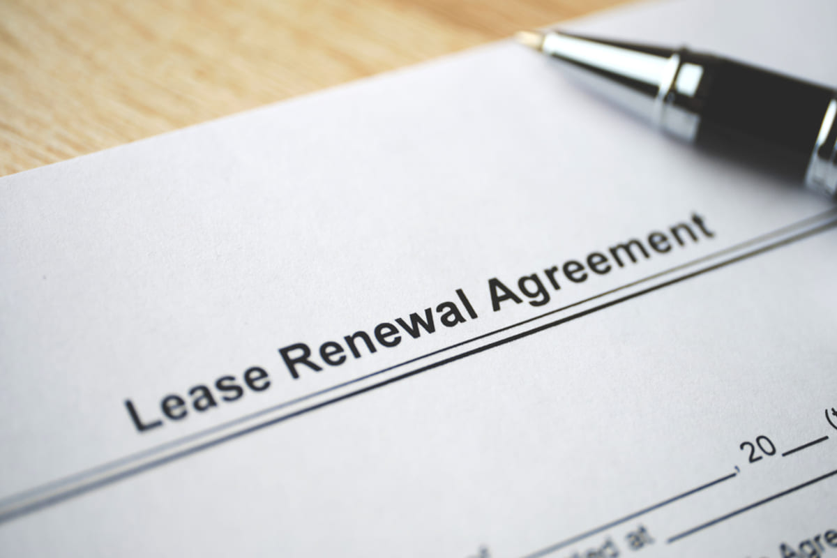 Legal document Lease Renewal Agreement on closing on paper.