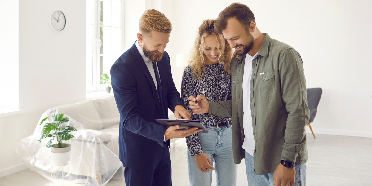 3 Excited young couple buyers sign contract